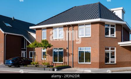 Dutch Suburban area with modern family houses in the Netherlands Stock Photo