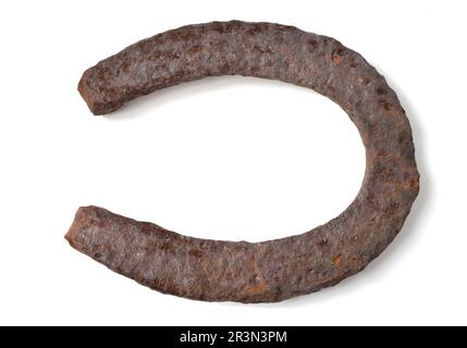 Old, rusty horseshoe isolated on white background. Stock Photo
