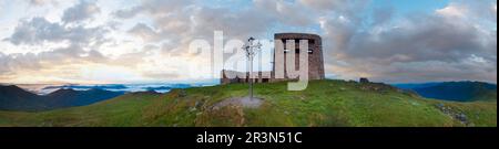 Summer sunrise observatory ruins panorama view on Pip Ivan mountain top with christianity cross near (Chornogora Ridge, Carpathi Stock Photo