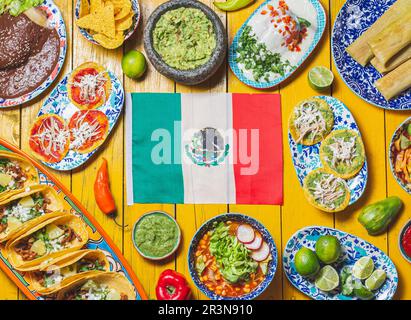 Mexican festive food for independence day independencia - around mexican flag. Top view , Yellow background. Stock Photo