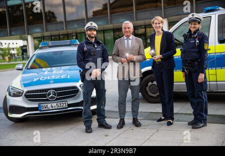 Stuttgart, Germany. 24th May, 2023. Thomas Strobl (2nd from left, CDU), Minister of the Interior of Baden-Württemberg, presents new lamps for the equipment of the Southwest Police with Baden-Württemberg's State Police President Stefanie Hinz (3rd from left) and two police officers. Credit: Christoph Schmidt/dpa/Alamy Live News Stock Photo