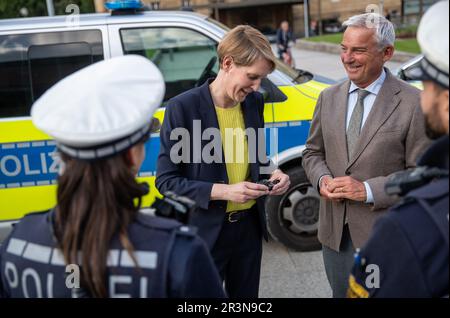 Stuttgart, Germany. 24th May, 2023. Baden-Württemberg's State Police President Stefanie Hinz (2nd from left) shows Baden-Württemberg's Interior Minister Thomas Strobl (3rd from left CDU), one of the new lamps for the equipment of the Southwest Police. Credit: Christoph Schmidt/dpa/Alamy Live News Stock Photo