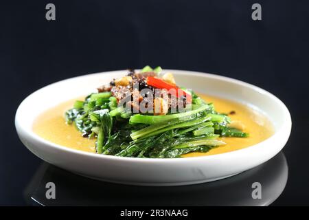 Stir Fried Yau Mak Choy with Fried Dace With Salted Black Beans，Stir Fried Taiwanese Lettuce A-Choy Stock Photo