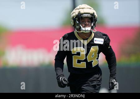 New Orleans Saints running back Travaris Cadet (38) is tripped up by  Jacksonville Jaguars strong safety Johnathan Cyprien (37) in the first half  of an NFL football game in New Orleans, Sunday