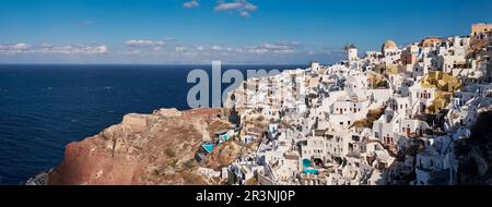 Panoramic Aerial View of Oia Village in Santorini Island, Greece - Traditional White Houses in the Caldera Cliffs Stock Photo