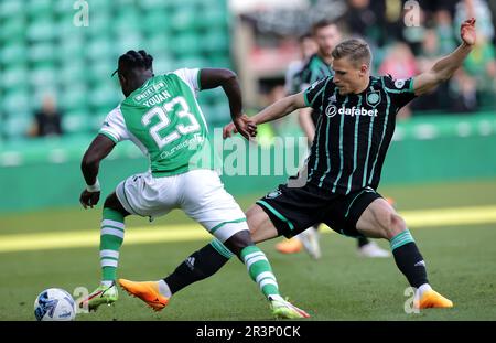 Hibernian's Elie Youan (left) and Celtic's Carl Starfelt battle for the ball during the cinch Premiership match at Easter Road, Edinburgh. Picture date: Wednesday May 24, 2023. Stock Photo