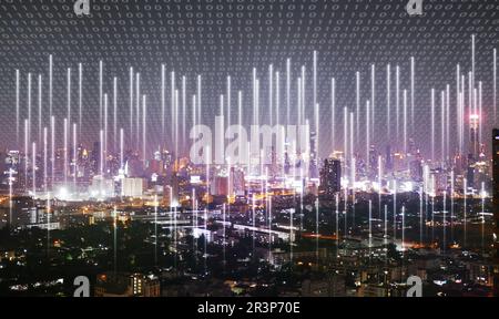 A city covered by binary code with cellular signal everywhere sending into the network. Wireless network and Connection technology concept Stock Photo