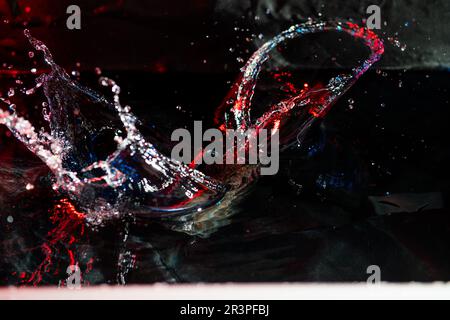 colorful splash of water on black background Stock Photo