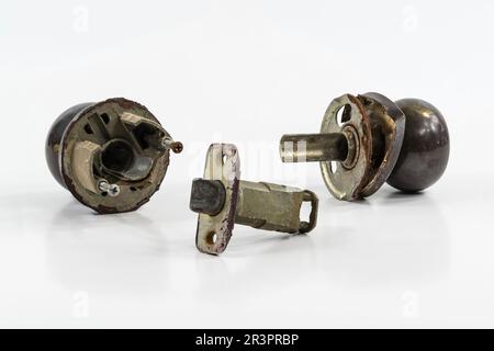 Broken old door knob with white background. Stock Photo