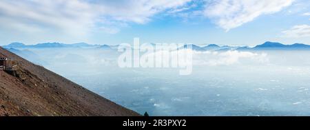 Morning cloudy top view of Naples city from Vesuvius mount slope (Italy). Panorama. Stock Photo