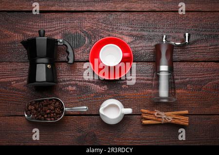 Flat lay composition with manual grinder and geyser coffee maker on wooden background Stock Photo