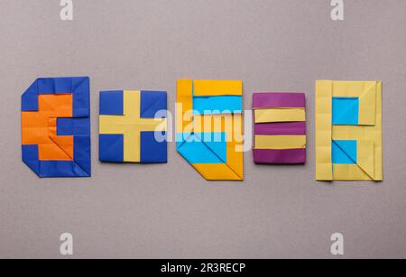 Mathematical operation, addition - three plus five equals eight. Numbers made of paper on light brown background, top view Stock Photo