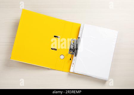 Open office folder on white wooden table, top view Stock Photo
