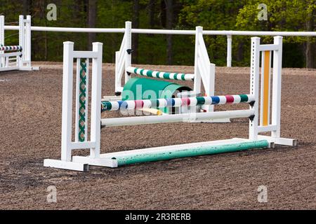 A Group Of Multiple Horse Jumps Inside An Equestrian Ring Before A Show Stock Photo