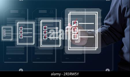 A man with a marker is checking and analyzing virtual documents. Paperless circulation of documents, remote control Stock Photo