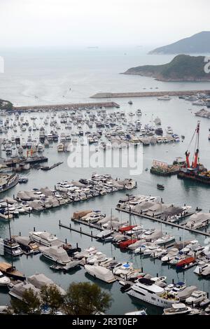 Yachts docking in the Aberdeen South Typhoon shelter, Sham Wan, Southern District, Hong Kong. Stock Photo