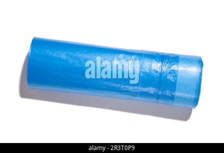 Blue plastic trash bags with strings on white background Stock Photo