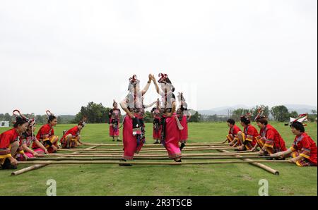 Longyou, China's Zhejiang Province. 24th May, 2023. Local residents perform traditional bamboo dance in Pushan Village of Longyou County, east China's Zhejiang Province, May 24, 2023. Pushan Village has donned a new look with improved public infrastructure and colorful decoration in the past years. Entertainment facilities and homestay businesses have also been developed to boost tourism and increase local villagers' income, injecting momentum and vitality into rural revitalization. Credit: Du Xiaoyi/Xinhua/Alamy Live News Stock Photo