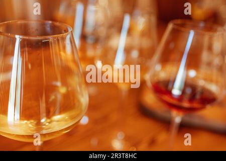 Glass goblets placed in rows on table during wine tasting procedure in restaurant Stock Photo