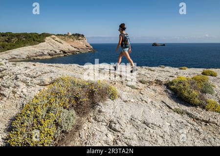 hikers in Cala Matzoc, Arta, Mallorca, Balearic Islands, Spain. Stock Photo