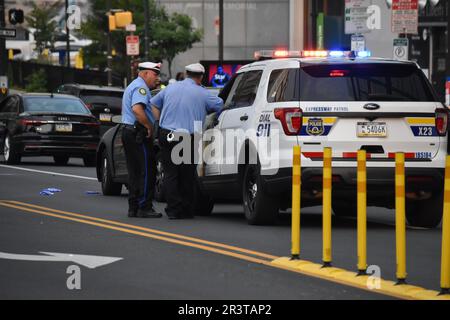 Philadelphia police officers investigate the scene. Road rage incident ...
