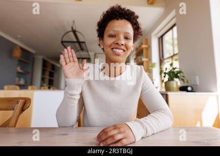 Happy african american woman having video call Stock Photo