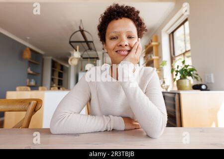 Happy african american woman having video call Stock Photo