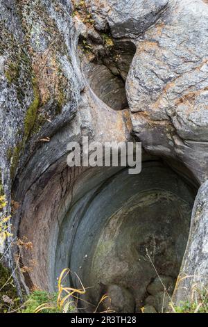 Cavaglia, Switzerland - October 30, 2021 : Glacial potholes from Glacier Mills or Giants pots in Cavaglia, Grisons, Switzerland Stock Photo