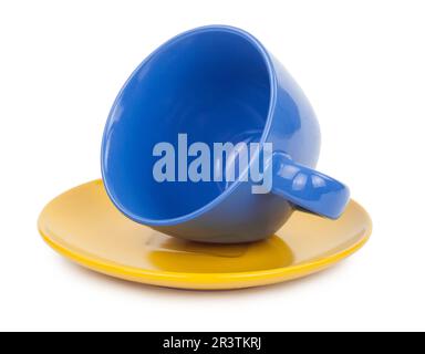 Blue cup of tea on a yellow saucer Stock Photo