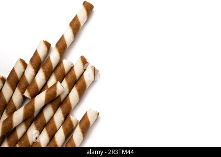 Wafer rolls with chocolate isolated on white background. Stock Photo