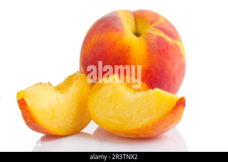 Ripe peach fruit with slices isolated on white background Stock Photo