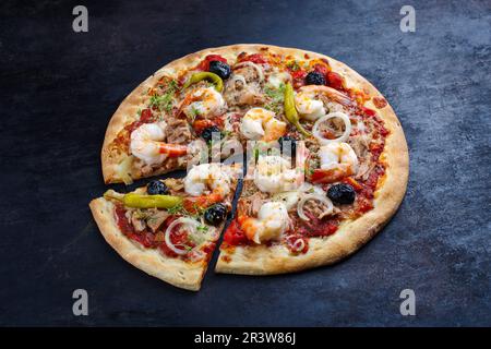 Traditional Italian pizza frutti di mare with king prawns Stock Photo