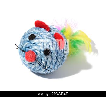 Round textile toy made of rope with feathers for animals on a white isolated background Stock Photo