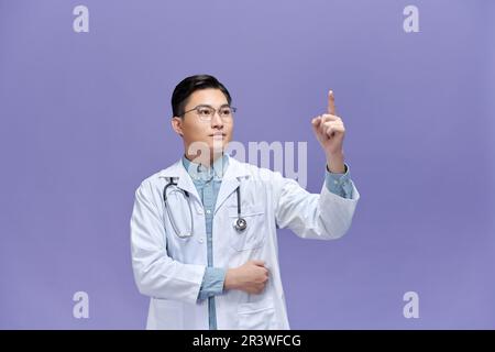 handsome doctor man touching something in air isolated, artificial intelligence concept Stock Photo