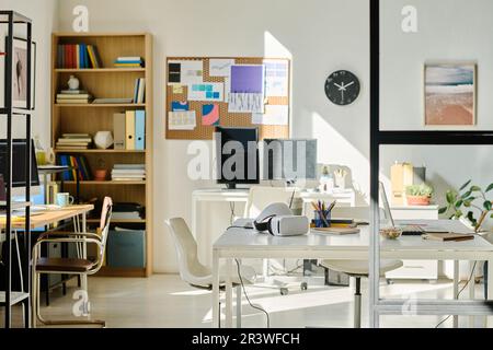 Horizontal image of modern IT office with computers on table Stock Photo