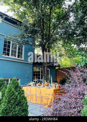 Wedding. Banquet. Chairs and a table for guests, decorated with candles, Stock Photo