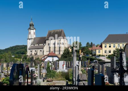 View of the parish church of St. Nicholas above Emmersdorf in Austria seen from the cemetery Stock Photo
