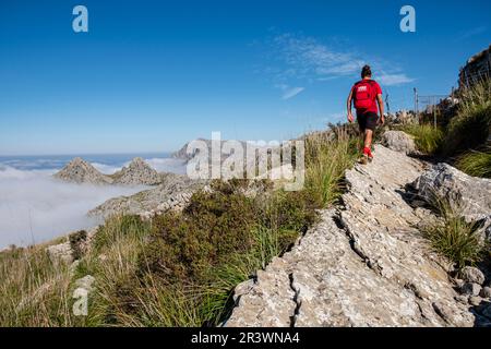 Hiker on the way to Es Binis Stock Photo