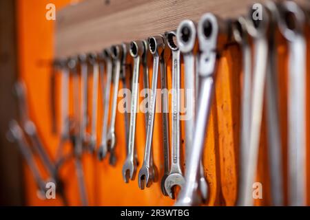 05.17.2023, Kemerovo, Moscow. Keys and work tools hang on the wall in a car  repair shop or garage. Dirty, working tool of an auto mechanic Stock Photo  - Alamy