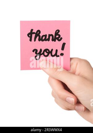 Woman holding sticky note with Thanks text Stock Photo - Alamy