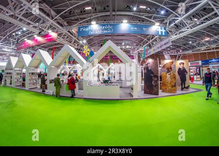 Turin, Italy - May 22, 2023: Publishers booth with books displayed in pavilion at the 35th Turin International Book Fair. Stock Photo