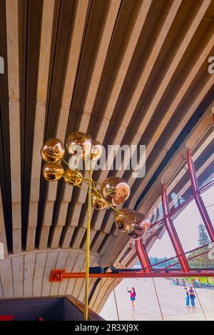 A close-up of the golden lighting constellations made with Tom Dixon ‘Melt’ glass lamps inside the Sydney Opera House, Bennelong Restaurant Stock Photo