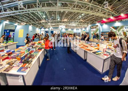 Turin, Italy - May 22, 2023: Adelphi Edizioni booth with visitors and with books displayed in the pavilion at the 35th Turin International Book Fair. Stock Photo
