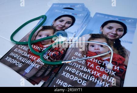 KYIV, UKRAINE - MAY 24, 2023 - A stethoscope lies on brochures as members of the public can undergo free diabetes screening and blood pressure tests i Stock Photo