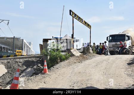 Bandung Regency, Tegalluar, West Java, Indonesia. May 25, 2023. A grinder train crosses the Jakarta-Bandung Fast Train Station in Tegalluar, Bandung Regency, Indonesia. Credit: Dimas Rachmatsyah/Alamy Live News Stock Photo