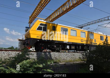 Bandung Regency, Tegalluar, West Java, Indonesia. May 25, 2023. A grinder train crosses the Jakarta-Bandung Fast Train Station in Tegalluar, Bandung Regency, Indonesia. Credit: Dimas Rachmatsyah/Alamy Live News Stock Photo