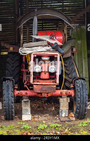 Vintage tractor in the garage of a shipyard Stock Photo