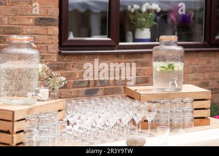 Glass jars of lemonade on party bar. Drinks on wedding party. Outside catering drinks service. Business, catering service. Drinks on summer party. Cat Stock Photo