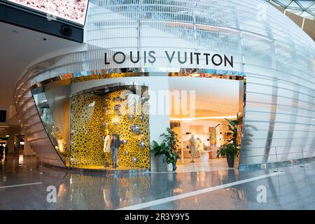 Louis Vuitton luxury store and lounge within Hamad International Airport in  Doha, Qatar, with an Orchard with sustainable Green Concourse Stock Photo -  Alamy