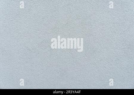 Captivating close-up of a wall adorned with elegant gray decorative stucco, adding a touch of sophistication to any space. Stock Photo